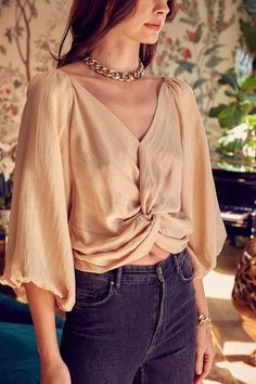 Introducing our "Effortless Elegance" Front Twist Detail Top, a fusion of style and sophistication. Crafted from a blend of 80% rayon and 20% nylon, this top offers a luxurious feel and a flattering fit. The front twist detail adds a touch of modern charm, creating an alluring focal point. Lined with 100% polyester for added comfort and a polished finish, this top seamlessly blends fashion and practicality. Elevate your ensemble with this versatile piece that transitions effortlessly from day to Front Twist Top, Twist Front Crop Top, Classic Blouse, Classic Blouses, Puff Sleeve Crop Top, Twist Top, Loose Tops, Sheer Fabrics, Polished Look