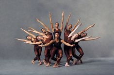 a group of ballet dancers posing for a photo