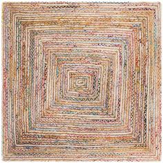 a multicolored area rug with an interlocking design on the center and sides