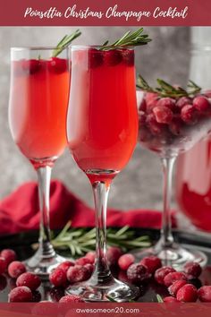 two wine glasses filled with cranberry champagne cocktails and garnished with rosemary