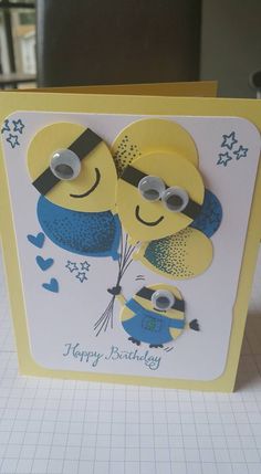 a card with two yellow and blue characters on it