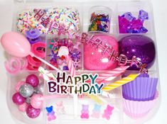 a plastic container filled with lots of birthday items