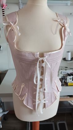 "the corset is sewn from cotton canvas, reinforced with metal bones, lined. It has lacing on the front and back. The holes are embroidered by hand. size 8 - bust 31\"1/2, waist 24\", hip 33\"1/2 size 10 - bust 32\"1/2, waist 25\", hip 34\"1/2 size 12 - bust 34\", waist 26\"1/2, hip 36\" size 14 - bust 36\", waist 28\", hip 38\" size 16 - bust 38\", waist 30\", hip 40\" size 18 - bust 40\", waist 32\", hip 42\" size 20 - bust 42\", waist 34\", hip 44\" size 22 - bust 44\", waist 37\", hip 46\" si Rococo Corset, Baroque Corset, Regency Corset, Ribbon Corset, Summer Sewing, Corset Back, Gilded Age, Sewing Design, Colour Star