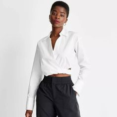 Future Collective White Side Cutout Cropped Poplin Long Sleeve Shirt With An Elastic Waist Brand New With Tags Size Large Spring Collared Shirt By Urban Outfitters, Urban Outfitters Collared Spring Shirt, Urban Outfitters Spring Collared Shirt, Urban Outfitters Button-up Workwear Top, Urban Outfitters Button-up Top For Work, Chic Cropped Blouse From Urban Outfitters, Casual Workwear Tops From Urban Outfitters, Urban Outfitters Casual Workwear Tops, Casual Urban Outfitters Tops For Work