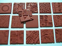 several different types of chocolates are arranged on a table together in squares and rectangles