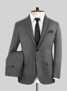 Experience the perfect fusion of taste and excellence by donning our Cavalry Twill Gray Wool  Suit, guaranteed to provide a sharp and distinguished profile. Handcrafted from a blend of wool fibers, this suit envelops you in a refined gray hue with a solid finish, offering versatility and comfort to elevate your lifestyle. Whether you're attending a wedding, embarking on a formal daytime excursion, or simply looking to enhance your style, this suit is the ideal choice for infusing sartorial elegance into your wardrobe. 
  Look Includes    Cavalry Twill Gray Wool  Fabric  Two Button Jacket Style  Notch Lapel   Horn Royal Black Buttons  Single Vent  Three Cuff Buttons  Two Welted Back Pockets on Trousers   Click 'Customize Now' to modify the look if needed.  
 
 Lining: Viscose; Dry Clean. Sharkskin Suit, Grey Wool Suit, Flannel Suit, Tailored Suit, Herringbone Tweed, Grey Tweed, Tweed Suits, Silk Suit, Linen Suit