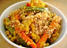 a white bowl filled with rice and vegetables