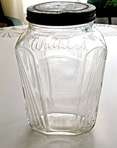 a glass jar sitting on top of a white table