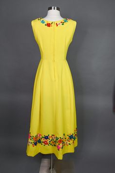 "What a lovely summer dress 😍 1960s Yellow Maxi Dress Small Gorgeous bright yellow with colorful yarn floral trim Fitted bodice and waist Zipper up the back Measurements are flat then doubled: Bust: 32\"-34\" Waist: 25\"-25\" Hips: 40\"-42\" Length: 52\" Zipper: 18\" Sweep: 100\" Materials: Feels like polyester and or blend/thick material, plastic zipper, yarn Condition is great, with some minor flaws, end/bottom of zipper needs to be resewn on, I didn't notice it until I zipped it back up, som 1970s Style Yellow Spring Dress, Yellow Retro Lined Dress, Beach Dresses Short, Yellow Maxi Dress, Yellow Maxi, Paisley Print Dress, Cap Dress, Green Floral Dress, Capped Sleeve Dress