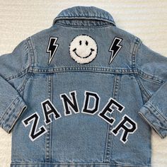 "Our personalized jean jackets are OH SEW DREAMY! These one-of-a-kind jackets are amazing as gifts, holidays and everyday wear. We recommend that you size up for longevity. This customized jean jacket comes with two options of personalization: name on shoulders and up to 3 patches on back or name on back and up to 3 patches on back. If you would like to add more than 3 patches on the back, additional patches can be purchased here for $4 per patch. https://www.etsy.com/listing/1319349068/add-more-patches-please **If you would like to see a picture of the layout before I sew, please send me a note with your order. Otherwise, I will use the information you provide to complete the order** LETS GET DREAMY JACKETS: Each jacket is made custom for you or your loved ones! Please know that your jack Customizable Denim Jacket For Fall, Customizable Blue Denim Jacket, Trendy Customizable Long Sleeve Denim Jacket, Customizable Cotton Denim Jacket For Fall, Customizable Long Sleeve Denim Jacket, Customizable Long Sleeve Denim Outerwear, Customizable Denim Outerwear For Fall, Customizable Fitted Denim Jacket, Casual Style, Customizable Fitted Denim Jacket Casual Style