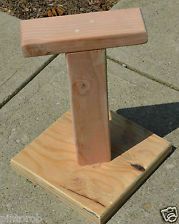 a wooden bench sitting on top of a sidewalk