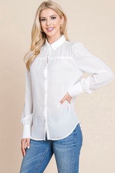 A basic button down shirt with a cream color. It is lightweight and has a hemline across the chest. There are buttons down the front to style this lightweight top opened or closed, along with buttons on the sleeves to be able to roll them up. Style open with a tee and jeans for a casual look. Model is 5'10" and wearing her true size Small. Small: Bust 17.5", Length 28" 100% Polyester Blouse Tops, Lightweight Tops, Bottom Clothes, Cardigan Tops, Bottoms Pants, Cream Color, Casual Looks, Sweater Cardigan, Jumpsuit Romper