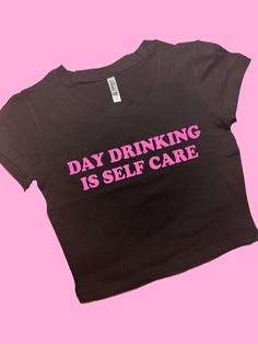 Day Drinking Is Self Care SNUG FIT Crop Top | Graphic Top | Gift For Her | Y2K Baby Tee | Y2K crop top | Gift for friend | Funny Slogan | Comfy Top to Lounge in! Actual item may be lighter/darker than pictured. M A T E R I A L S - SNUG FIT - 100% RING SPUN COTTON - Shoulder Taping S I Z I N G - Size chart is available on our listing photos. S H I P P I N G  &  P R O D U C T I O N  T I M E - Production Time is 5 Business Days. (May be delayed during the Holiday Season) - Shipping Time is 2-6 Busi Black Slogan Crop Top T-shirt, Fitted Crew Neck Crop Top With Funny Text, Black Y2k Tops With Funny Text, Cute Black Crop Top With Letter Print, Cute Black Crop Top With Text Print, Trendy Black Cropped T-shirt With Screen Print, Trendy Crew Neck Crop Top With Screen Print, Fitted Graphic Tee Crop Top With Funny Text, Fitted Crew Neck Crop Top With Screen Print