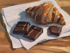 a painting of some chocolate and a croissant on a white plate next to it