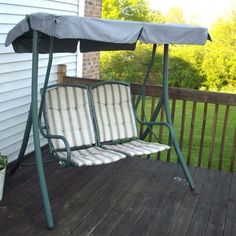 a porch swing with a cover on it