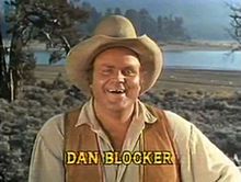 a man wearing a cowboy hat and vest with the words dan blocker on it