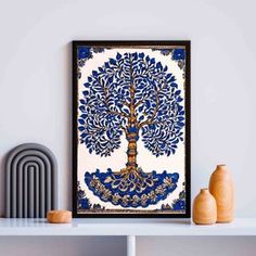 a blue and white tree is hanging on the wall