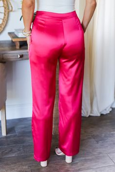 Unleash your inner fashionista with The Kimberly Satin Trousers! These vibrant hot pink pants will make a statement wherever you go. Pair them with a chic white blouse for a stylish and sophisticated look. Stand out from the crowd in these satiny pants that are sure to turn heads. (Fashion-forward and fun-loving!) 100% Polyester Color: Fuchsia Style: Satin Trousers Front Pleat detail Straight Leg Functional front pockets No back pockets Button & Clasp Closure Front Zipper No Shorts lining No Ela Satin Trousers Outfit, Women Trousers Design, Hot Pink Pants, Trouser Outfit, Satin Trousers, Satin Pants, Color Fuchsia, Pink Pants, Fun Loving