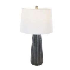 a table lamp with a white shade on it