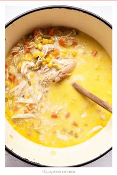 a pot filled with chicken and corn soup