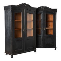 an old black armoire with glass doors and shelves on wheels, isolated against a white background