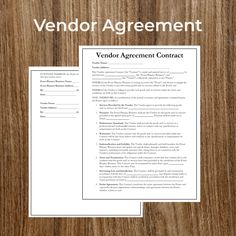 a vendor agreement is shown on top of a wooden table