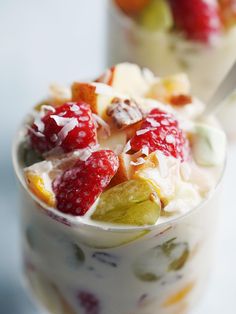 two cups filled with fruit and yogurt