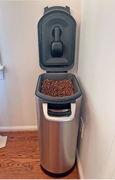 a dog food dispenser in the corner of a room