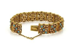 "This beautiful Retro bracelet is crafted from 18k yellow gold with a smooth polished finish. There are 13 rectangular shape links connected by long bar hinge, they are decorated with etruscan floral design and turquoise beads in bezel setting. This fine bracelet show a hallow inside with circle gallery stencil back and front. It secures with a push in clasp and chain attached for added security. Material: 18k yellow gold Measurements: 7.5\" x 0.66\" wide x 0.22\" high Gemstone: turquoise Weight Elegant Turquoise Jewelry With Bracelet Strap, Rectangular Gold Bracelet, Luxury Rectangular Jewelry With Intricate Design, Formal Turquoise Rectangular Jewelry, Luxury Rectangular Gold Bracelet, Vintage Yellow Gold Hinged Bracelet, Vintage Yellow Gold Tarnish-resistant Bracelet, Fine Bracelet, Luxury Hand-strung Turquoise Bracelets