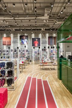 the inside of a sports store with many items on display