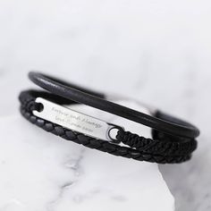 Our personalised men's bracelet has two leather strands either side of a cord creating a completely unique look to be stacked with other leather and cord designs. A stylish and classic bracelet with three strands of treated, hard-wearing plaited leather with a stainless steel plate. The stainless steel plate can be personalised with a message of your choice, to make this a sentimental and completely bespoke personal gift. Get this leather bracelet personalised with a date and co-ordinates as a reminder of your wedding day or honeymoon, or with a lovely message for your Dad from the loves of his life. * * * * * * * * * * * * * How to Order  * * * * * * * * * * * * 1. Select size options from the drop-down menu  2. Add to cart and proceed to checkout 3. Submit your personalisation in the req Branded Gift Bags, Mens Bracelet Personalized, Man Bracelet, Personalized Leather Bracelet, Mens Bracelets, Bday Gift, Custom Bracelet, Classic Bracelets, Stainless Steel Plate