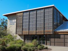 a large building with a metal roof and windows