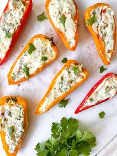 stuffed peppers with cheese and cilantro garnished with parsley