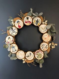 a wreath made out of wooden slices with different designs