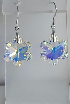 This pair of earrings features Clear AB  Swarovski crystal Snowflakes. The findings are Sterling Silver including fish hook ear wires.  Custom Orders are always welcome! Xmas Earrings, Crystal Snowflakes, Snowflake Earrings, Providence Ri, Fish Hook, Ear Wires, Swarovski Crystal, Custom Orders, Sterling Silver Earrings