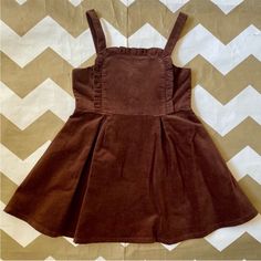 Rich Chocolate Brown Fine Corduroy Pinafore Dress. Adjustable Straps And An Apron Front With A Little Ruffle Around The Top. Flared Circle Skirt. Buttons On The Back And A Full Lining. New Without Tags. Perfect For Fall And Thanksgiving With A Shirt And A Hair Bow From My Closet. Also For Sale In Pink. Corduroy Pinafore, Corduroy Pinafore Dress, Amanda Uprichard Dress, An Apron, Ponte Dress, Nike Tennis Dress, Corduroy Dress, Girls Stripes, Tweed Dress