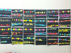 a bulletin board with different colored dots on it