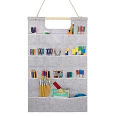 an over the door hanging organizer holds pens, pencils and other office supplies