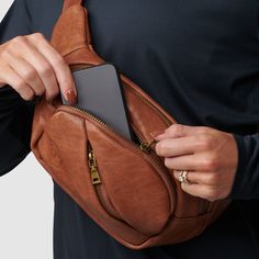 No matter if you’re wearing it over the shoulder or around the waist—our Crew Fanny Pack keeps all of your small essentials secure with plenty of style thanks to the faux leather material. With four zippered compartments, it’s perfect for everyday outings, travel days, sightseeing, morning walks, and anywhere else you take it. Casual Brown Belt Bag For Everyday Use, Everyday Brown Belt Bag With Zipper Pocket, Functional Brown Belt Bag For Everyday Use, Casual Belt Bag For Everyday Fall Use, Versatile Belt Bag For Travel In Fall, Fall Travel Leather Belt Bag, Versatile Fall Travel Belt Bag, Leather Belt Bag For Fall Travel, Brown Travel Belt Bag With Zipper