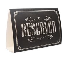 a black and white sign with the word reserved written on it's front side