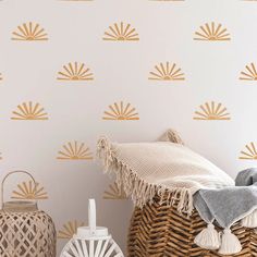 the wallpaper in this room is gold and has fringed tassels on it