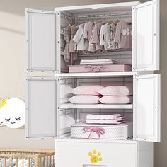 a baby's nursery closet with clothes and crib in the corner next to it