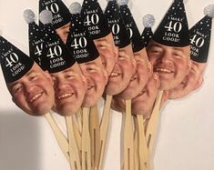 a bunch of stickers with faces on them that say 40 and look like they are wearing birthday hats