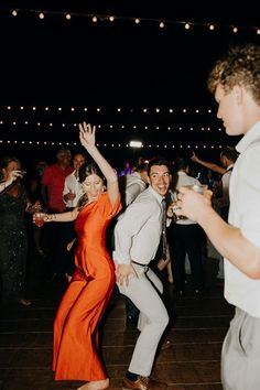 two people dancing on the dance floor at a wedding