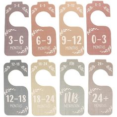 six wooden door hangers with numbers and months on them, including one for each month