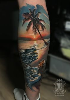 a man's arm with a sunset and palm tree on the beach tattoo design