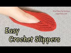 a person wearing red slippers with the words easy crochet slippers