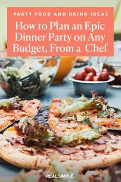 a table topped with pizza and salads on top of it