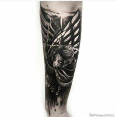 a man's leg with a black and white tattoo design on it, featuring an angel