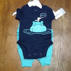 Three Snaps On The Bodysuit Casual Blue Onesie For Playtime, Casual Blue Onesie For Summer, Playful Blue Cotton Onesie, Playful Blue Onesie For Summer, Fitted Blue Bodysuit For Playtime, Blue Fitted Bodysuit For Playtime, Playful Blue Short Sleeve Bodysuit, Cute Blue Short Sleeve Onesie, Casual Blue Summer Onesie